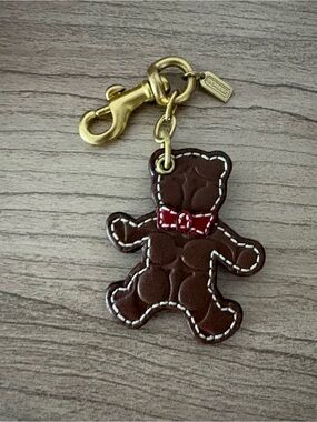 Coach signature Brown Bear Leather Key Charm with Red Bow and Gold Hardware